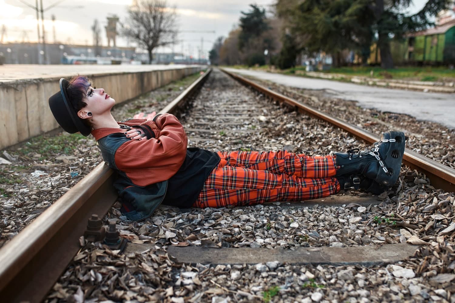 A girl lying on railway tracks